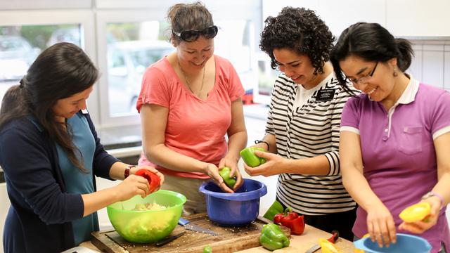 Missionaries in the kitchen preparing food