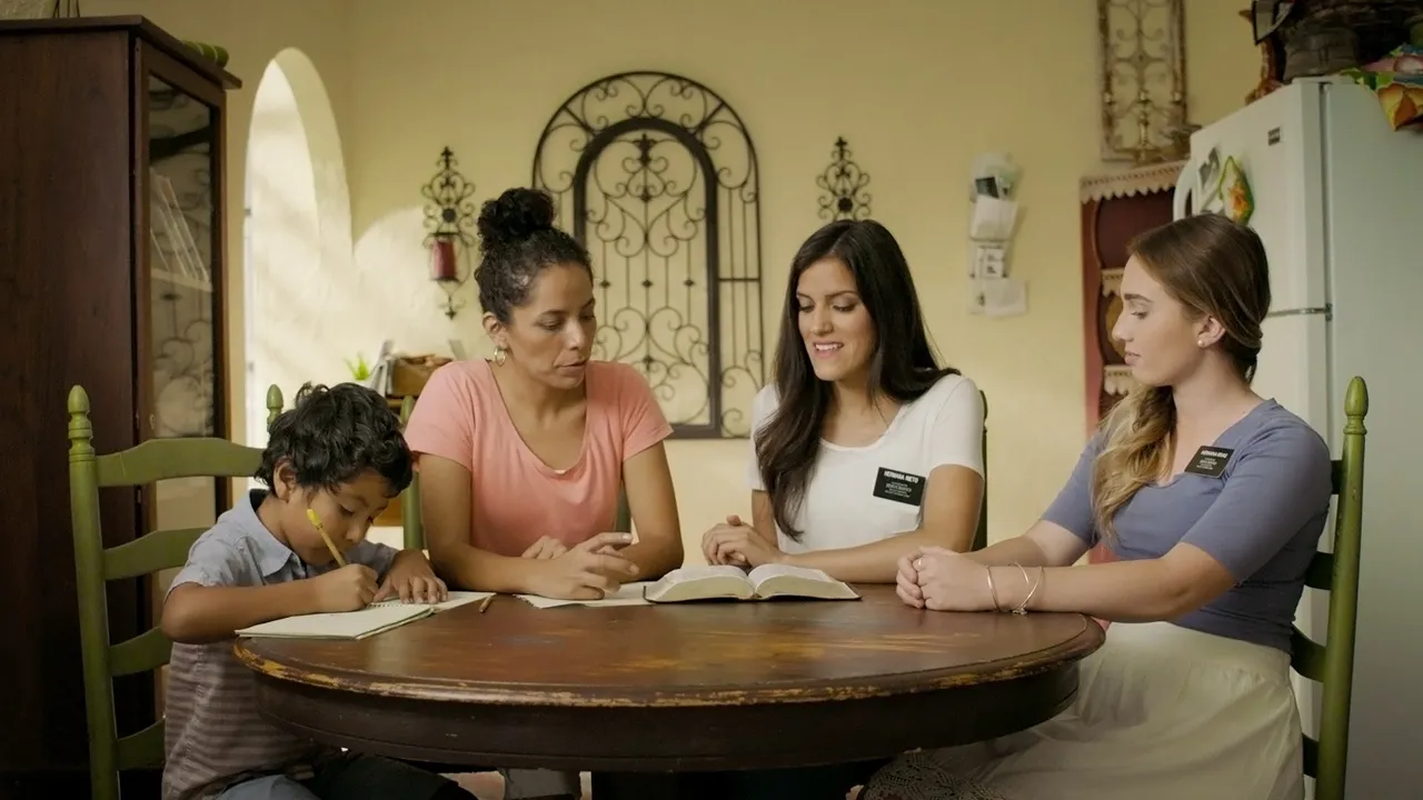 Missionaries teaching a lesson